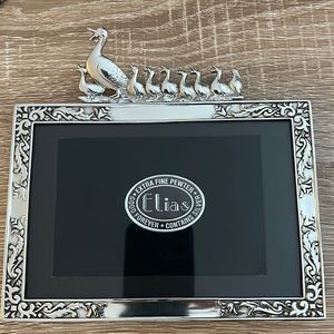 silver picture frame with ducklings